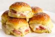 Delicious Hot Ham and Cheese Sliders on Hawaiian Rolls with Poppy Seed