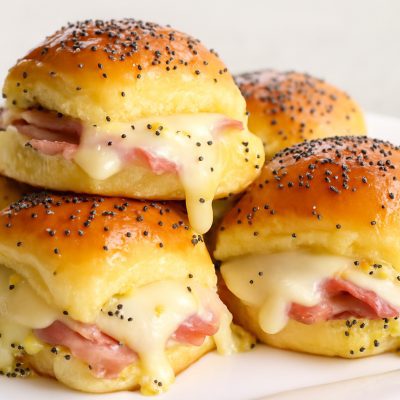 Delicious Hot Ham and Cheese Sliders on Hawaiian Rolls with Poppy Seed