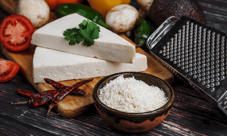Cotija Cheese: The Salty, Crumbly Delight and Its Best Substitutes 11 A single shot focusing on grated cotija cheese, illustrating what is cotija cheese in detail, while also hinting at a cotija cheese substitute for those curious about cojita cheese alternatives.